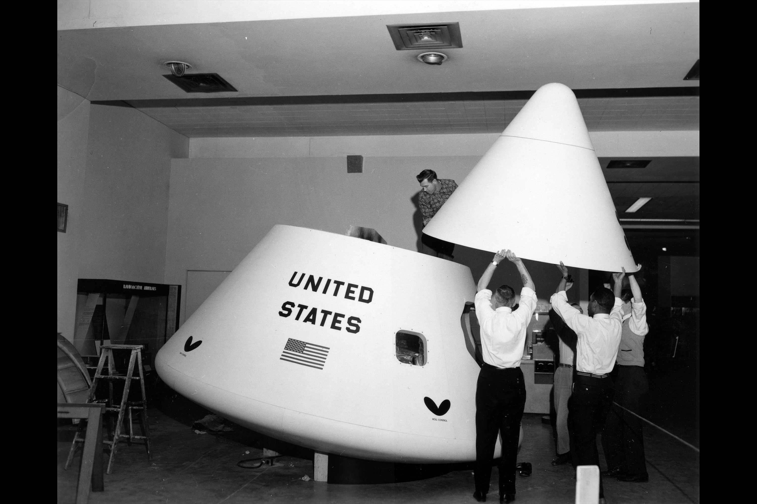 Apollo Space Capsule. This is a photograph of the Apollo command module being assembled by Museum staff.