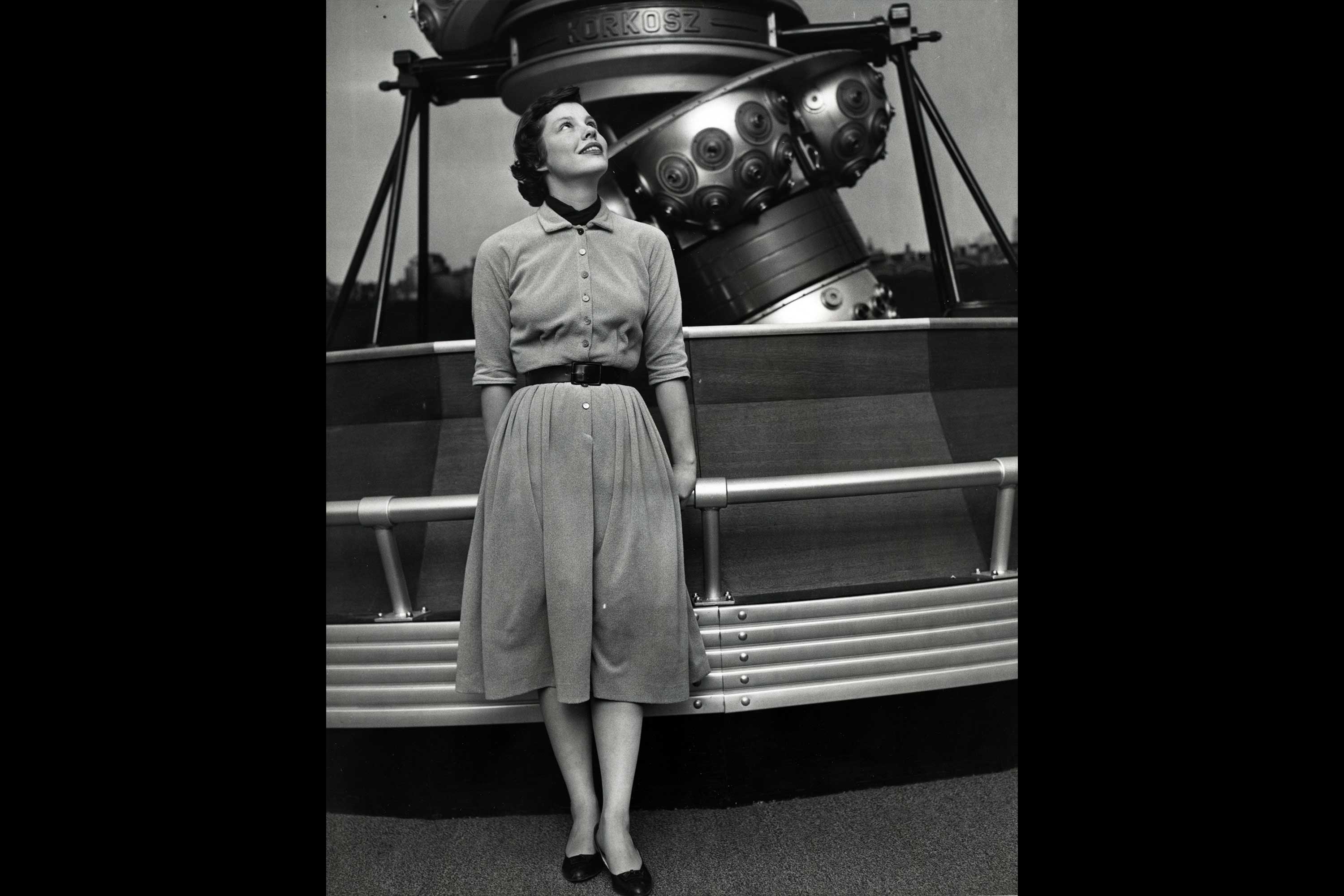 Valerie Wilcox 1958. This is a photograph of a woman in front of the first Charles Hayden Planetarium projector.